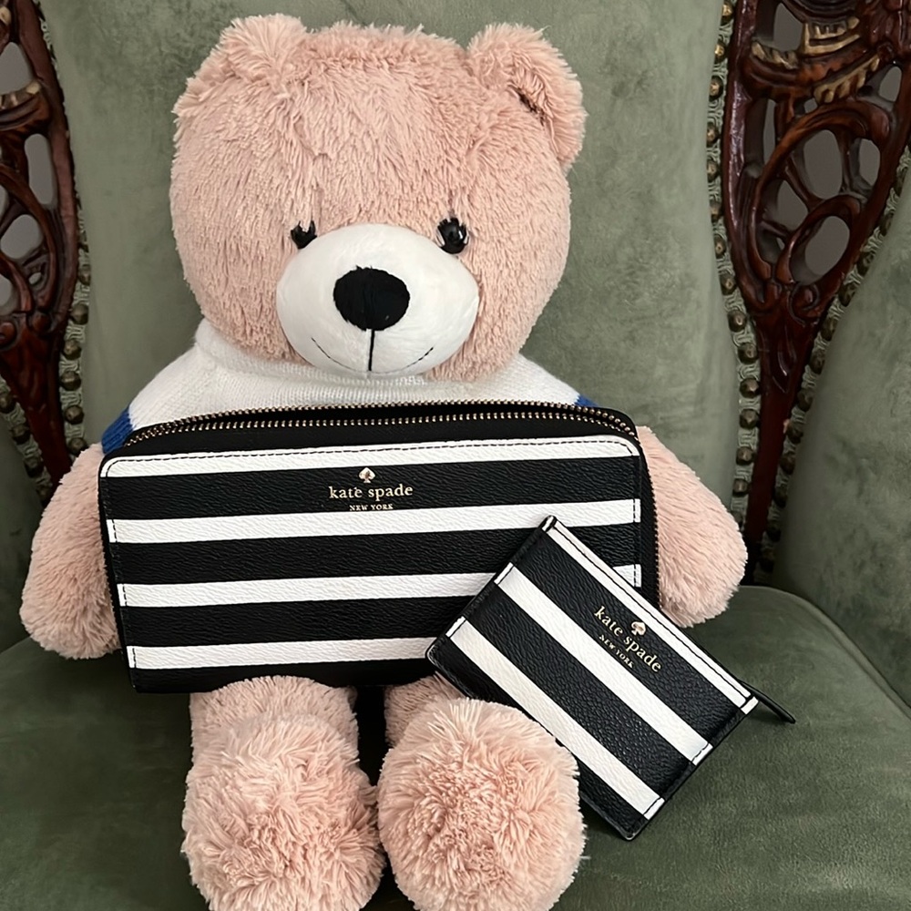 Almost new kate spade black and white wallet with small insert.